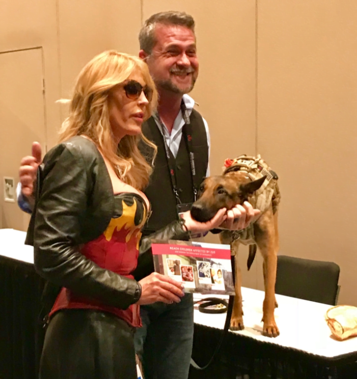 A dominatrix trainer stopped by at the Adult Entertainment Expo. She was very nice and wanted to help.